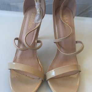 Tall and strappy nude heels